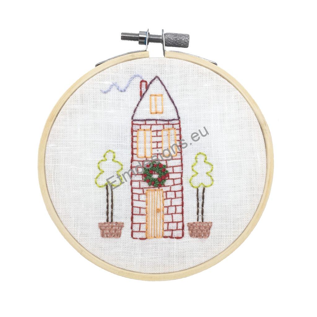 Christmas house with a wreath hand embroidery